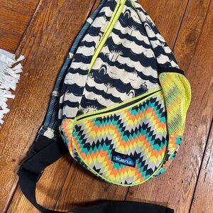Nautical themed Kavu Sling Bag with Vibrant Geometric and Wave Patterns